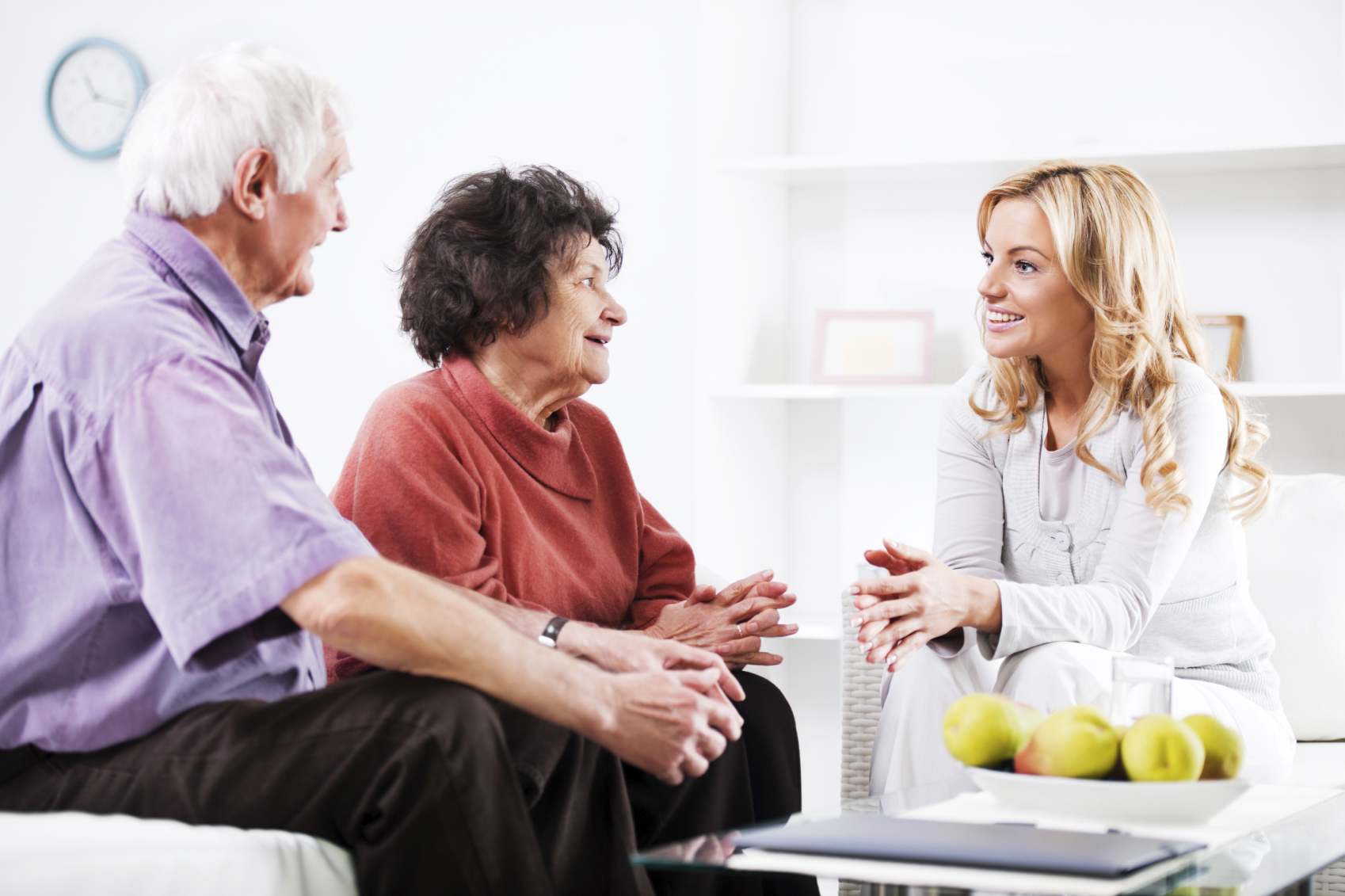 Daughter talking to her elderly parents.